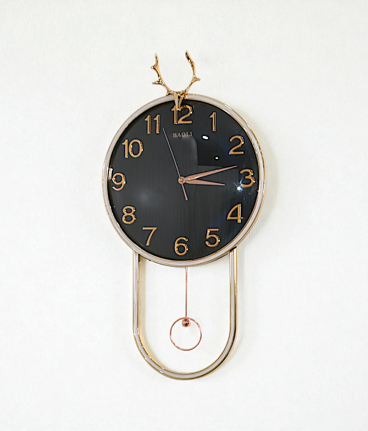 wall clock with golden deer & pendulum black china "25x15"
