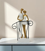 statue couple standing on stairs white china