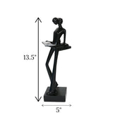 statue holding book black china