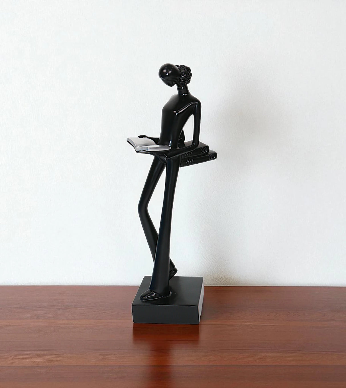 statue holding book black china
