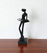 statue holding book black china
