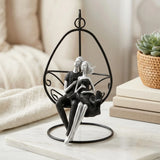 statue couple sitting on swing black 10"x5.5" china