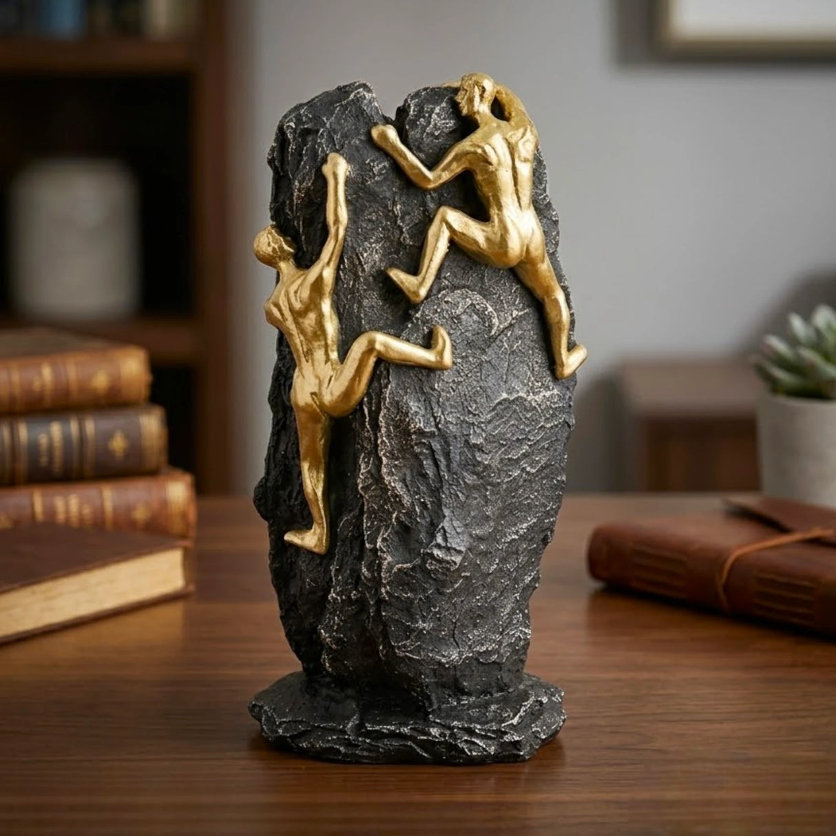 statue 2 figures climbing mountain black & golden 11''x5'' china