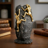 statue 2 figures climbing mountain black & golden 11''x5'' china