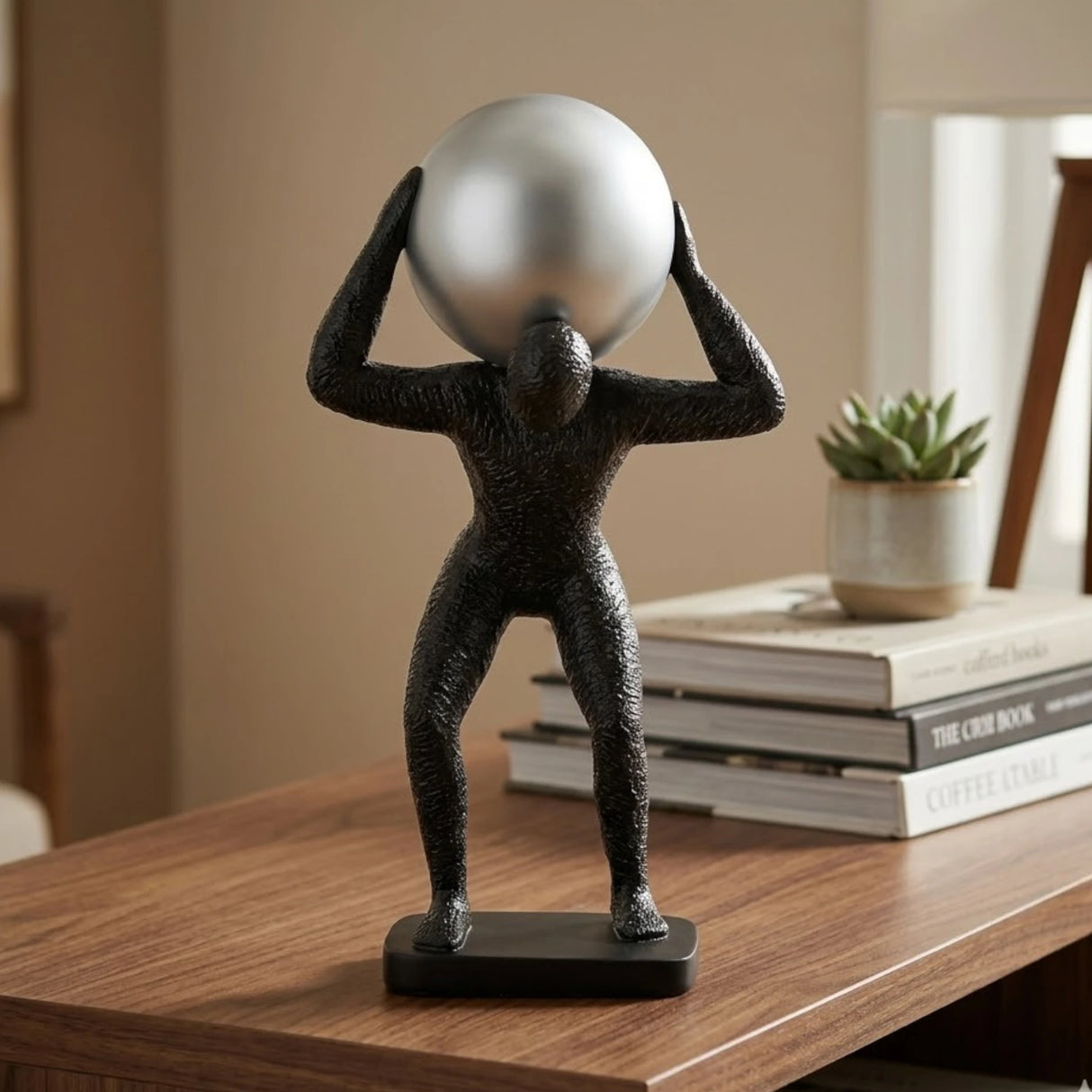 statue man holding sphere black & silver 13''x5'' china