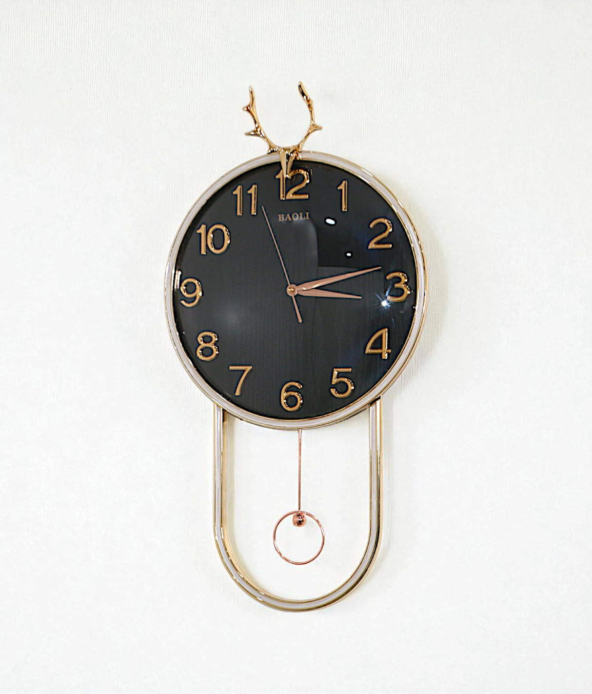 wall clock with golden deer & pendulum black china "25x15"