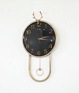 wall clock with golden deer & pendulum black china "25x15"